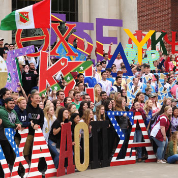 Fraternity and Sorority members standing on MU steps