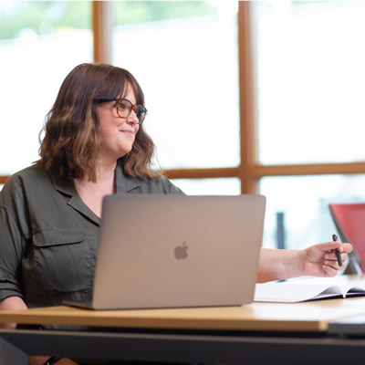 Ecampus student working in front of computer