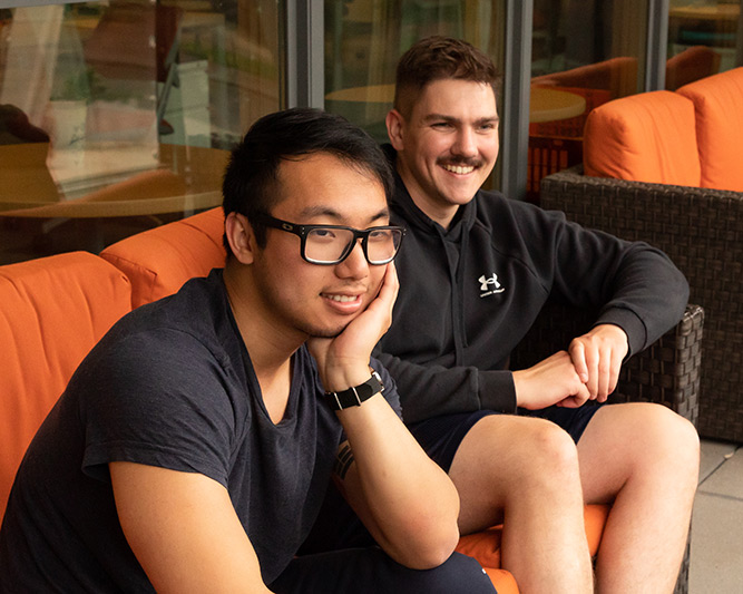 students sitting together outside