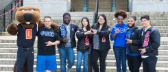 Fraternity and Sorority members standing on MU steps with Benny