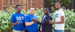 Four students pose outside the Lonnie B. Harris Black Cultural Center