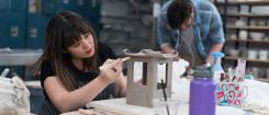 Student uses clay to make small house