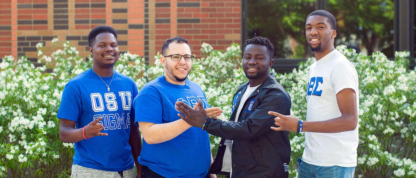 Four students pose outside the Lonnie B. Harris Black Cultural Center
